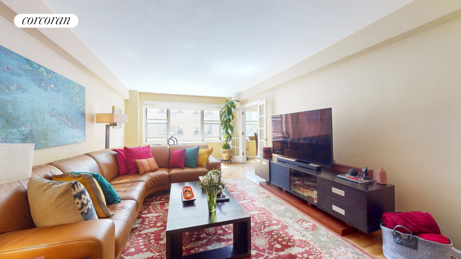 a living room with furniture and a flat screen tv