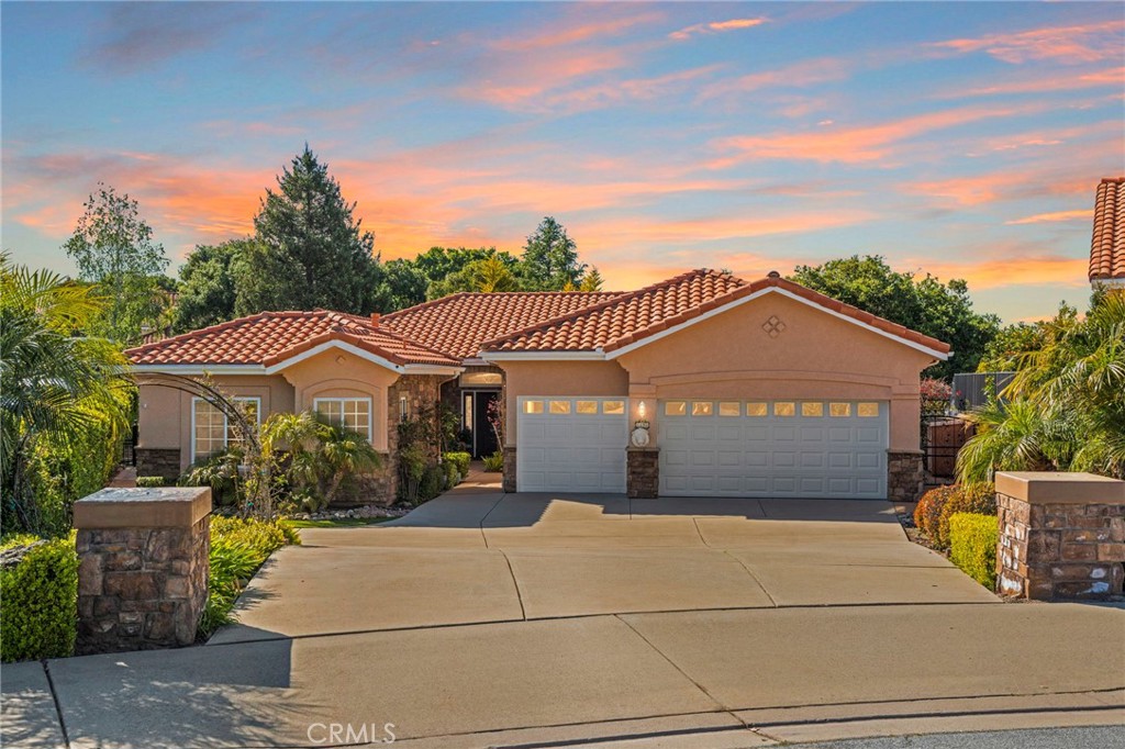 a front view of a house with a garage