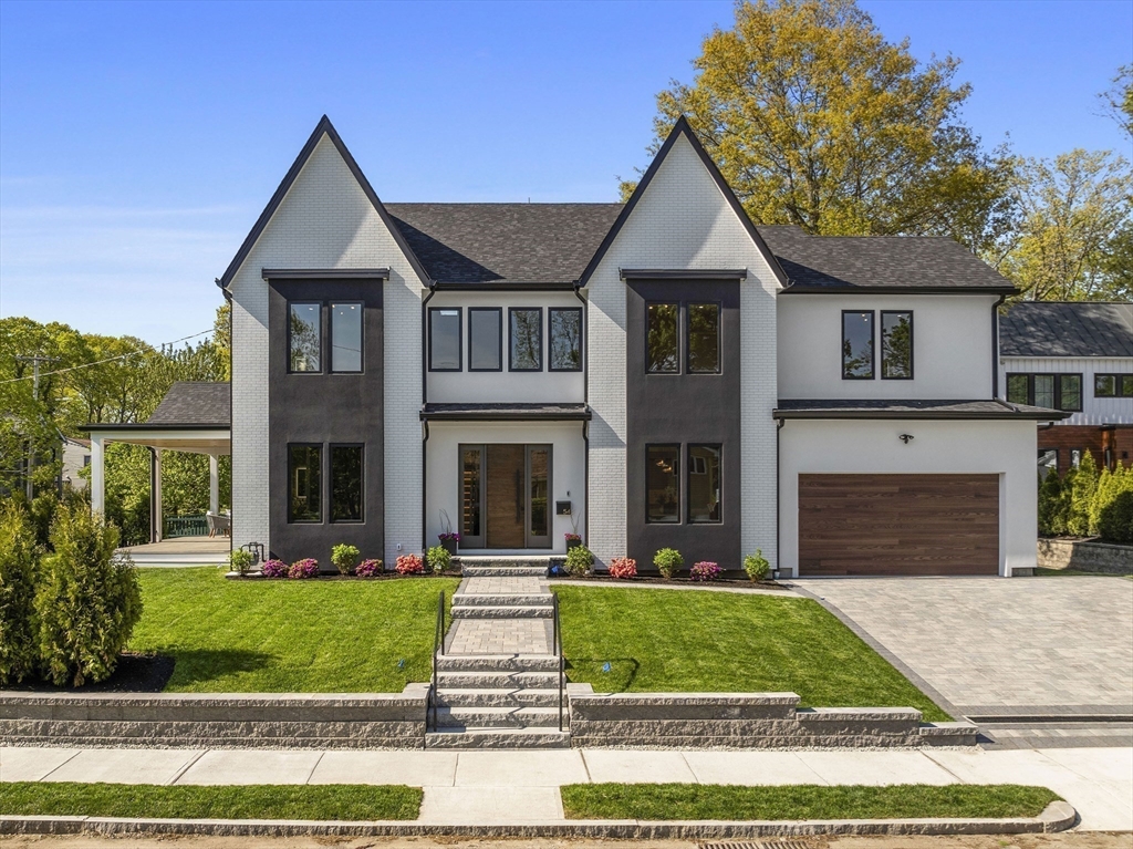 a front view of a house with a yard