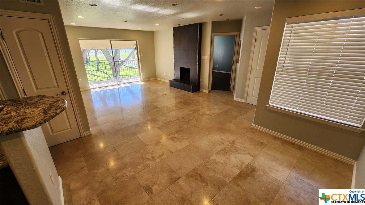 a view of livingroom with furniture and a window