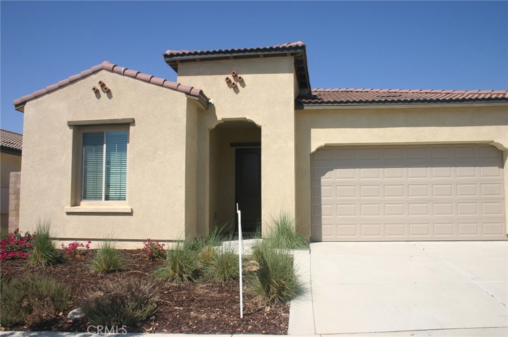 a view of a house with a door and a window