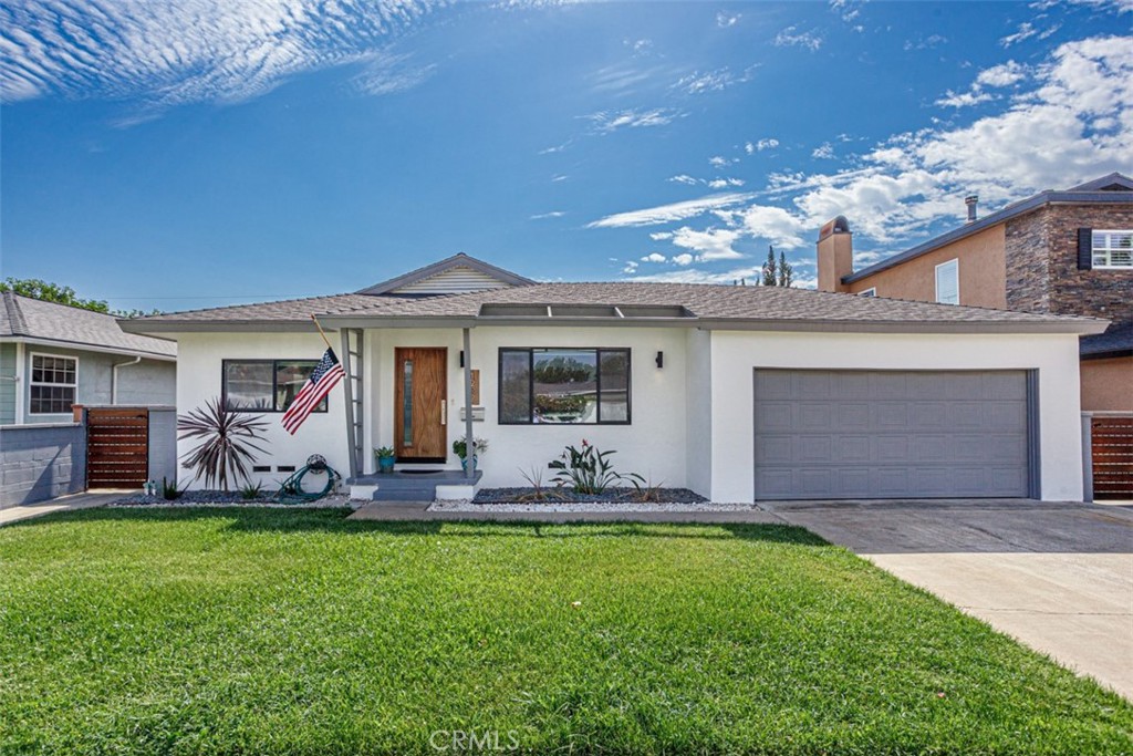 a front view of house with outdoor seating