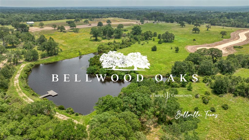 an aerial view of a golf course with a lake view