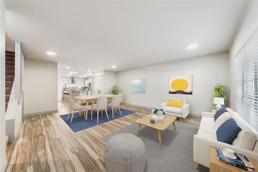 Welcome to 6313 Del Monte! This unit features a bright, open-concept living space with modern flooring and recessed lighting. The room flows seamlessly into a kitchen area, offering a cohesive living environment.