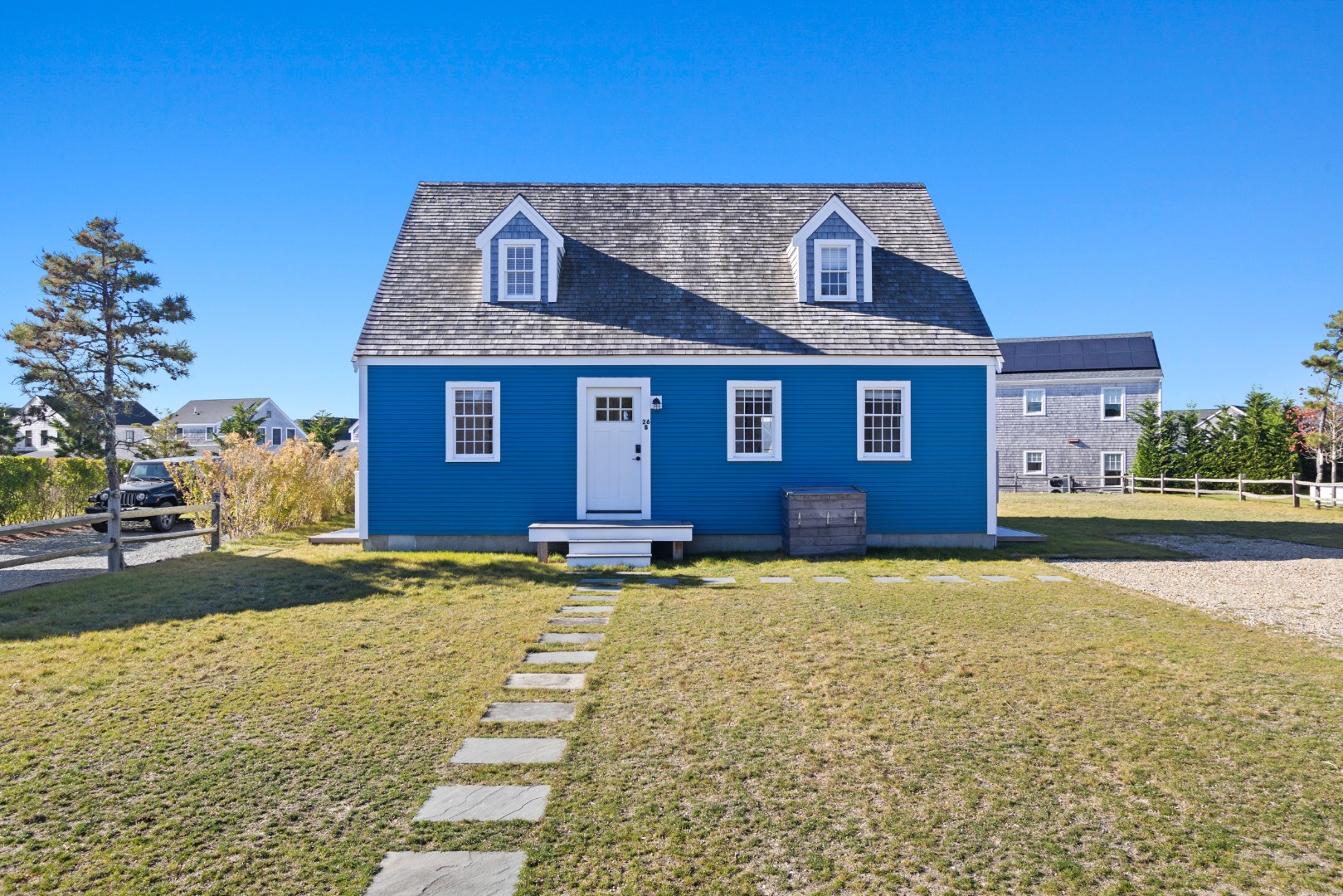 a view of a brick house with a yard