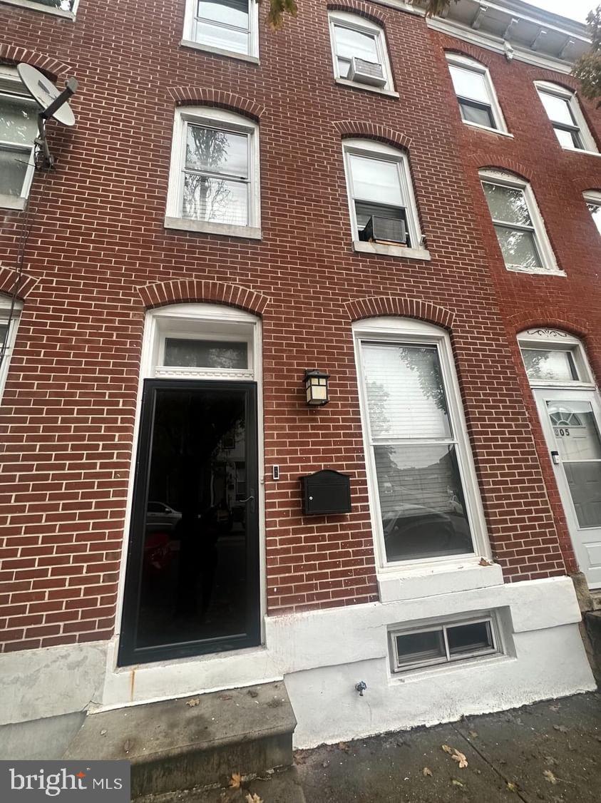 a view of a brick house with a door