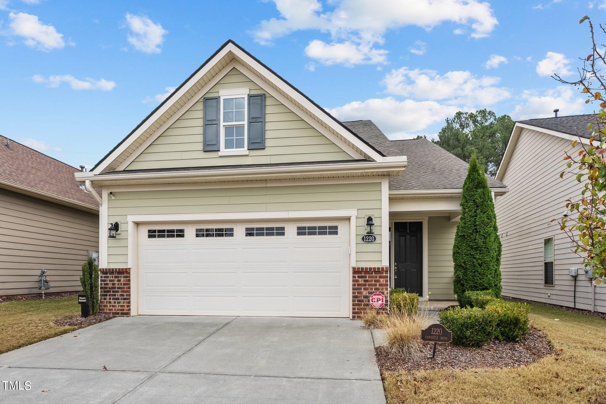 a front view of a house with a garage