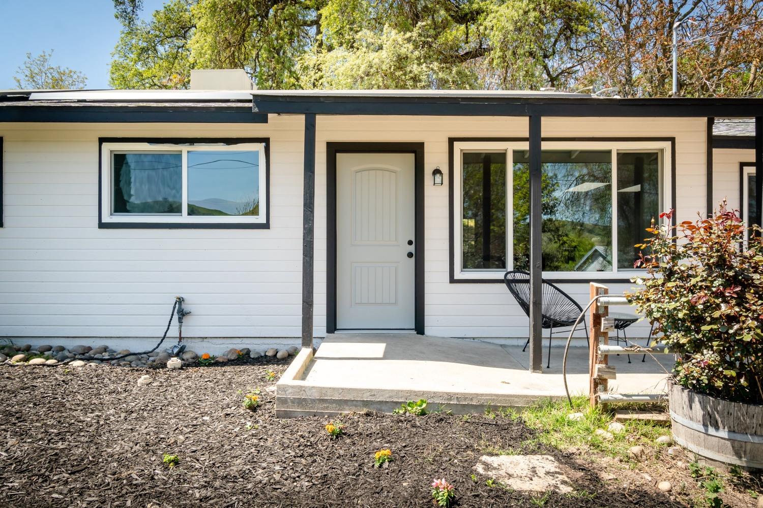 a front view of a house with garden