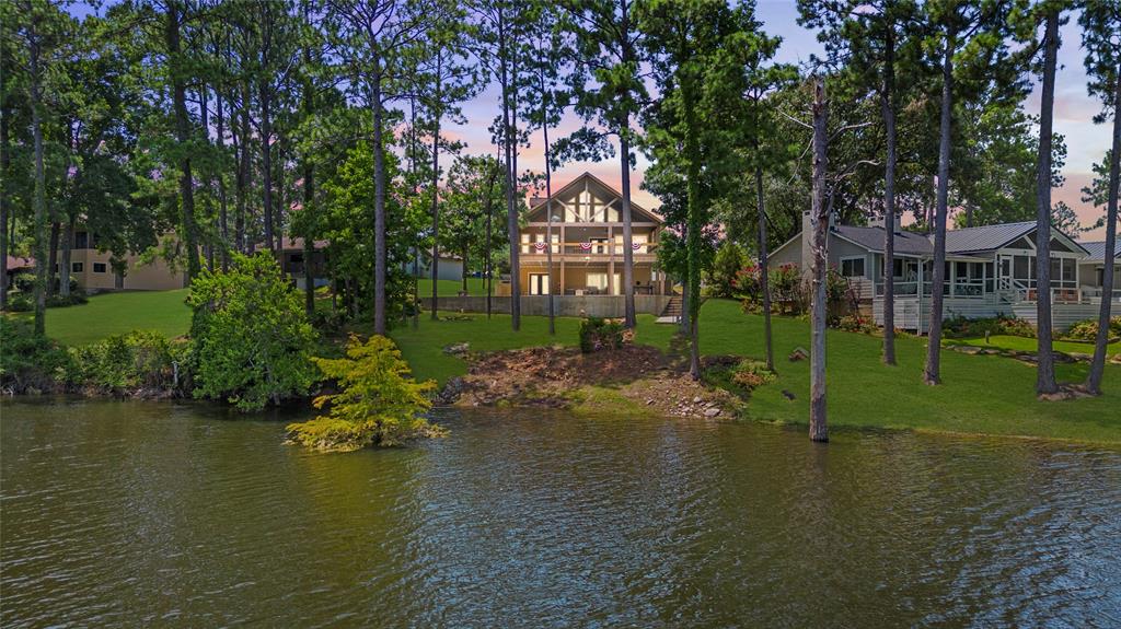 a view of a lake with a house in the background