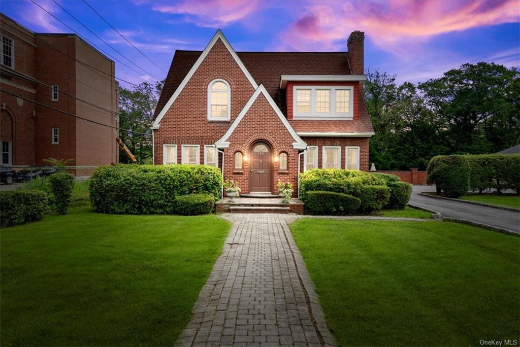 a front view of a house with yard