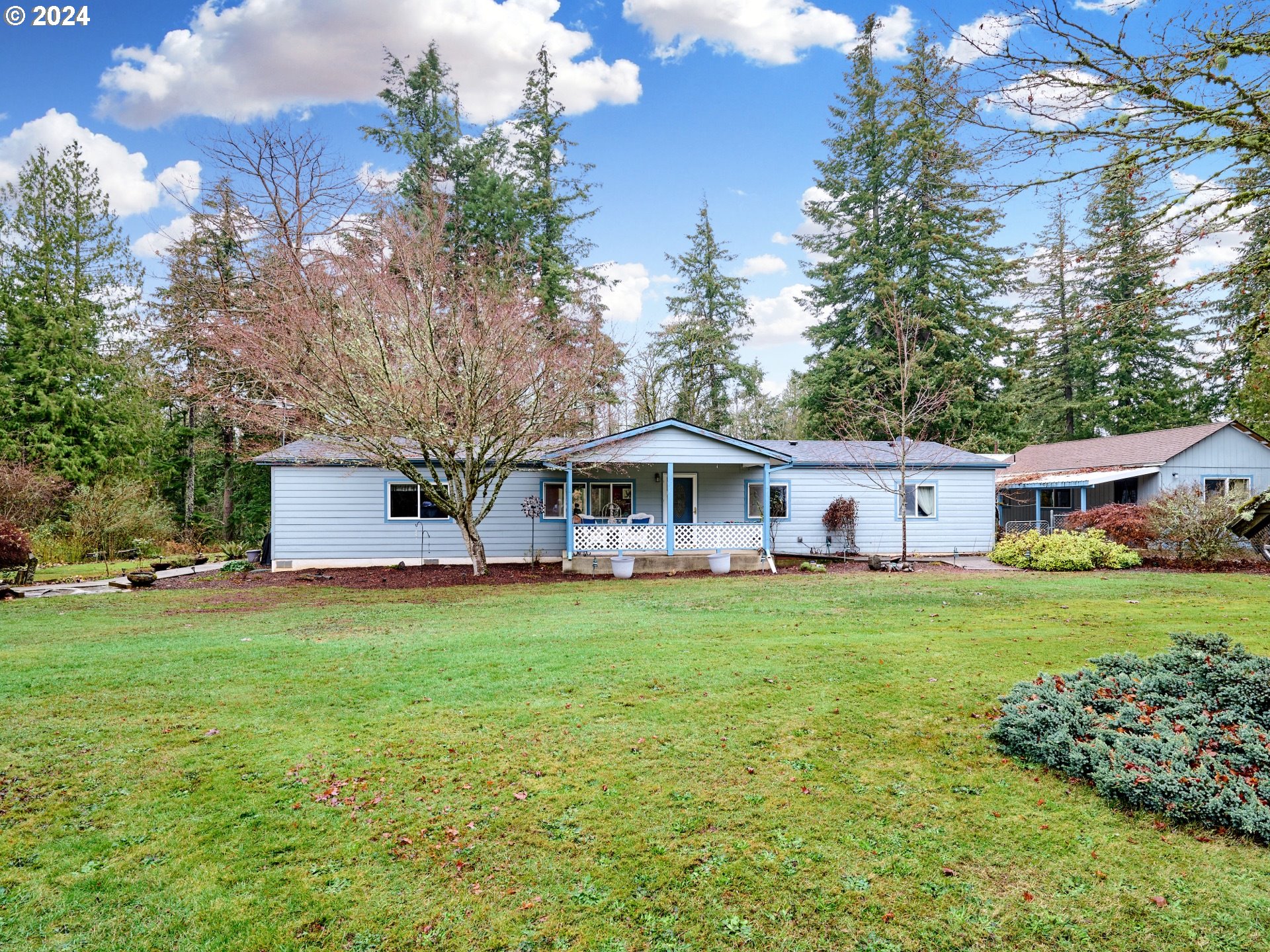 a front view of a house with garden