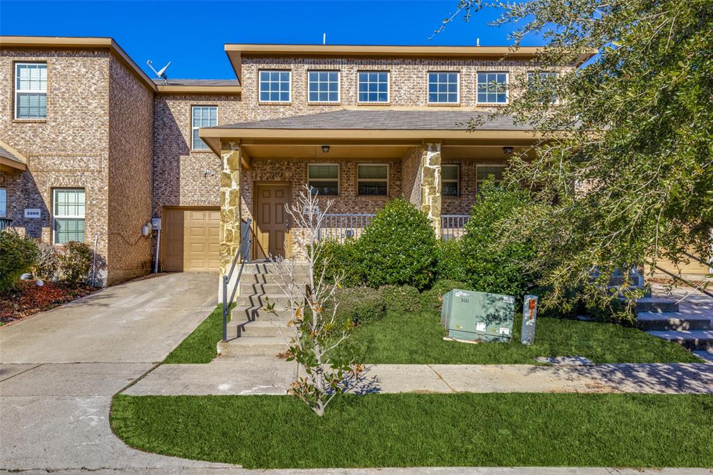 front view of a house with a yard