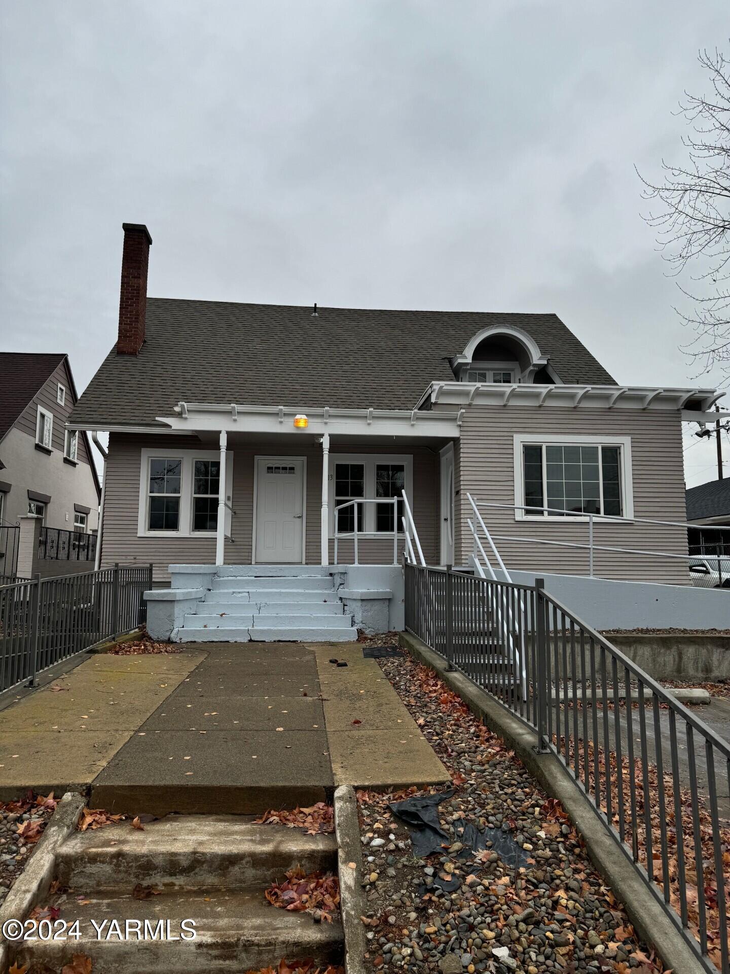 a front view of a house with yard