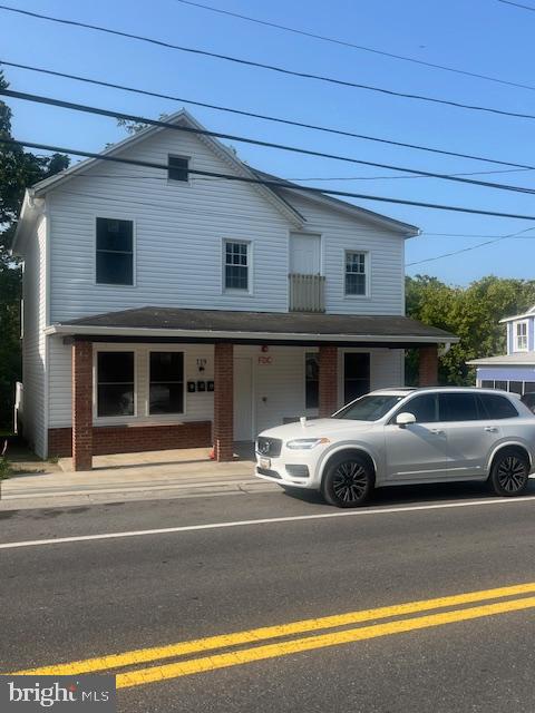 a view of a car parked front of a house