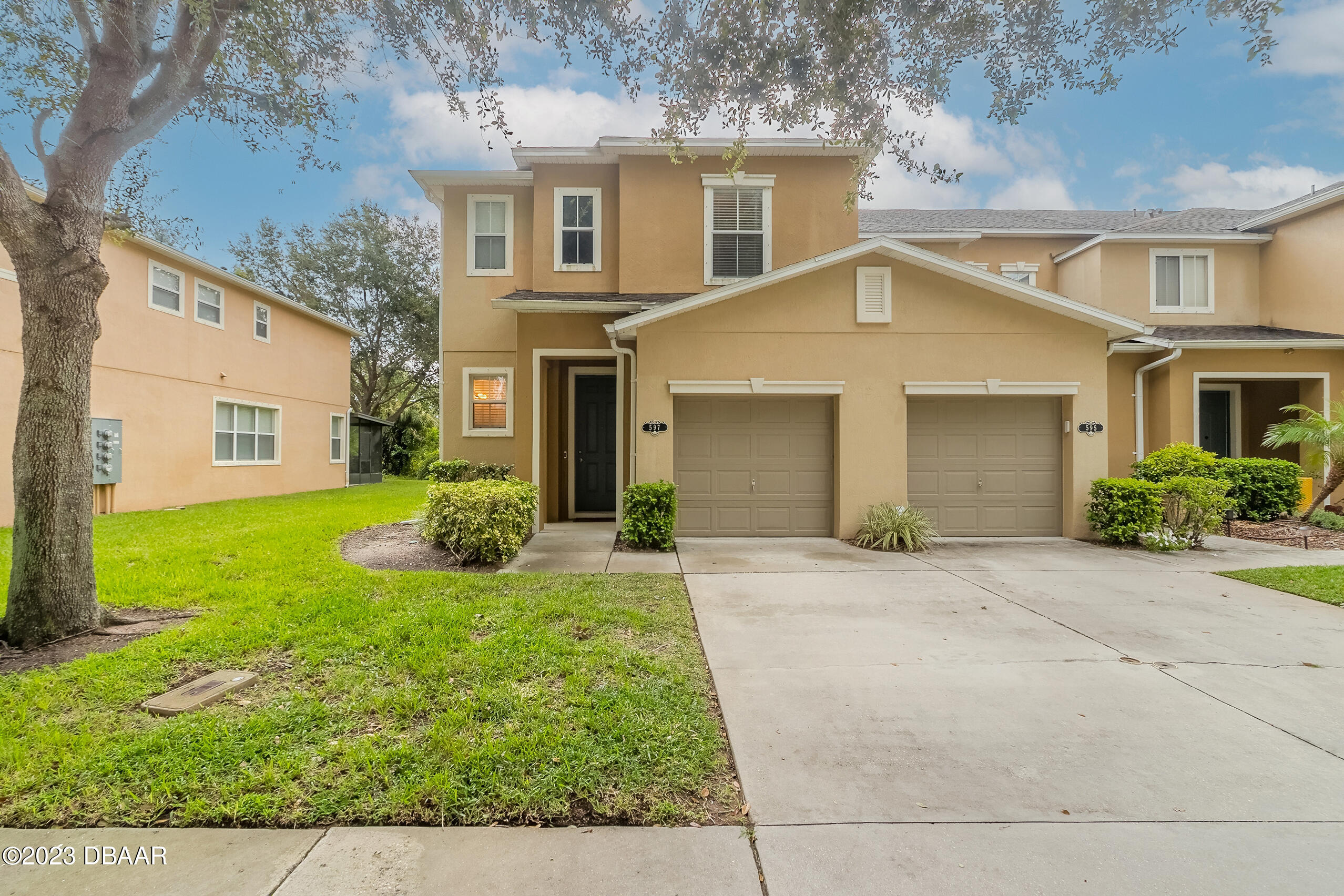 a front view of a house with a yard