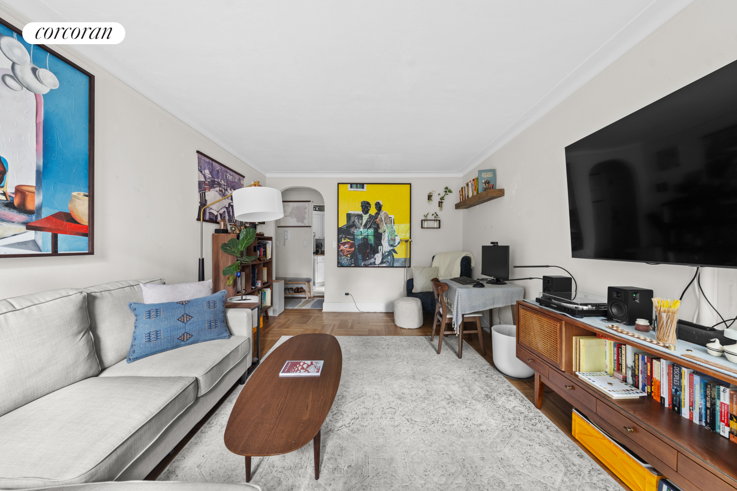 a living room with furniture and a flat screen tv