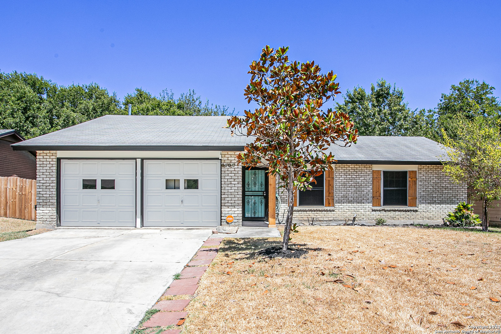 a house with trees in the background