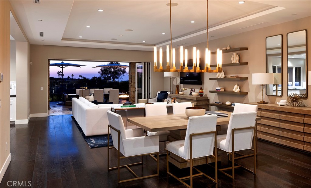 a large kitchen with a table and chairs