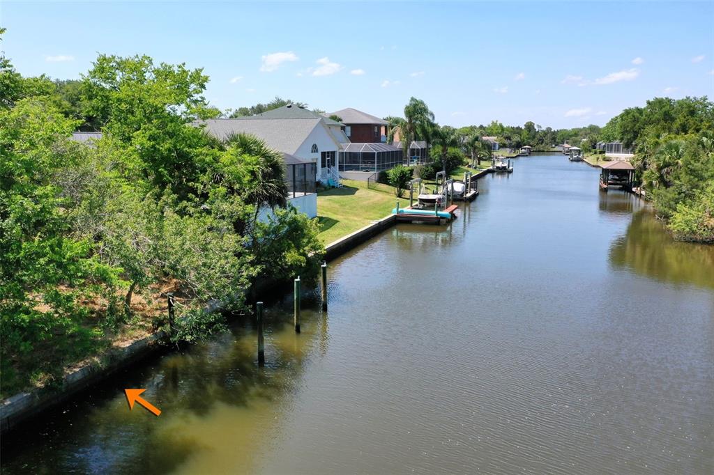 a view of residential houses with outdoor space and lake view