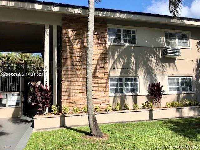 a view of front door and small yard