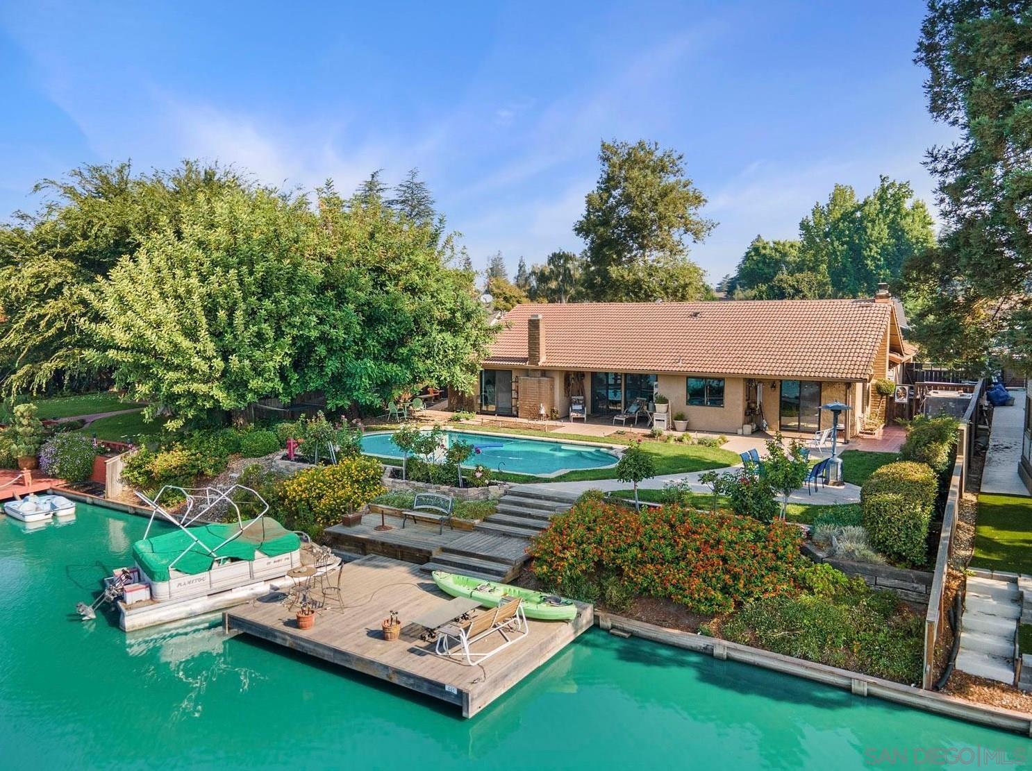 an aerial view of a house with garden space and street view