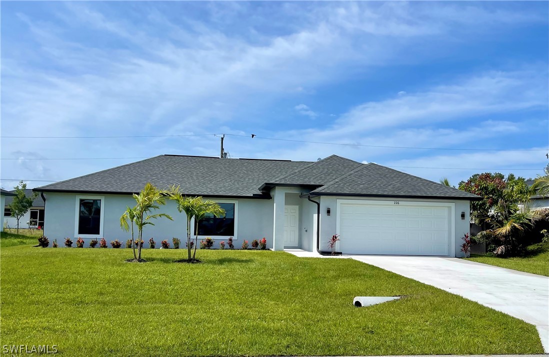 front view of a house with a garden