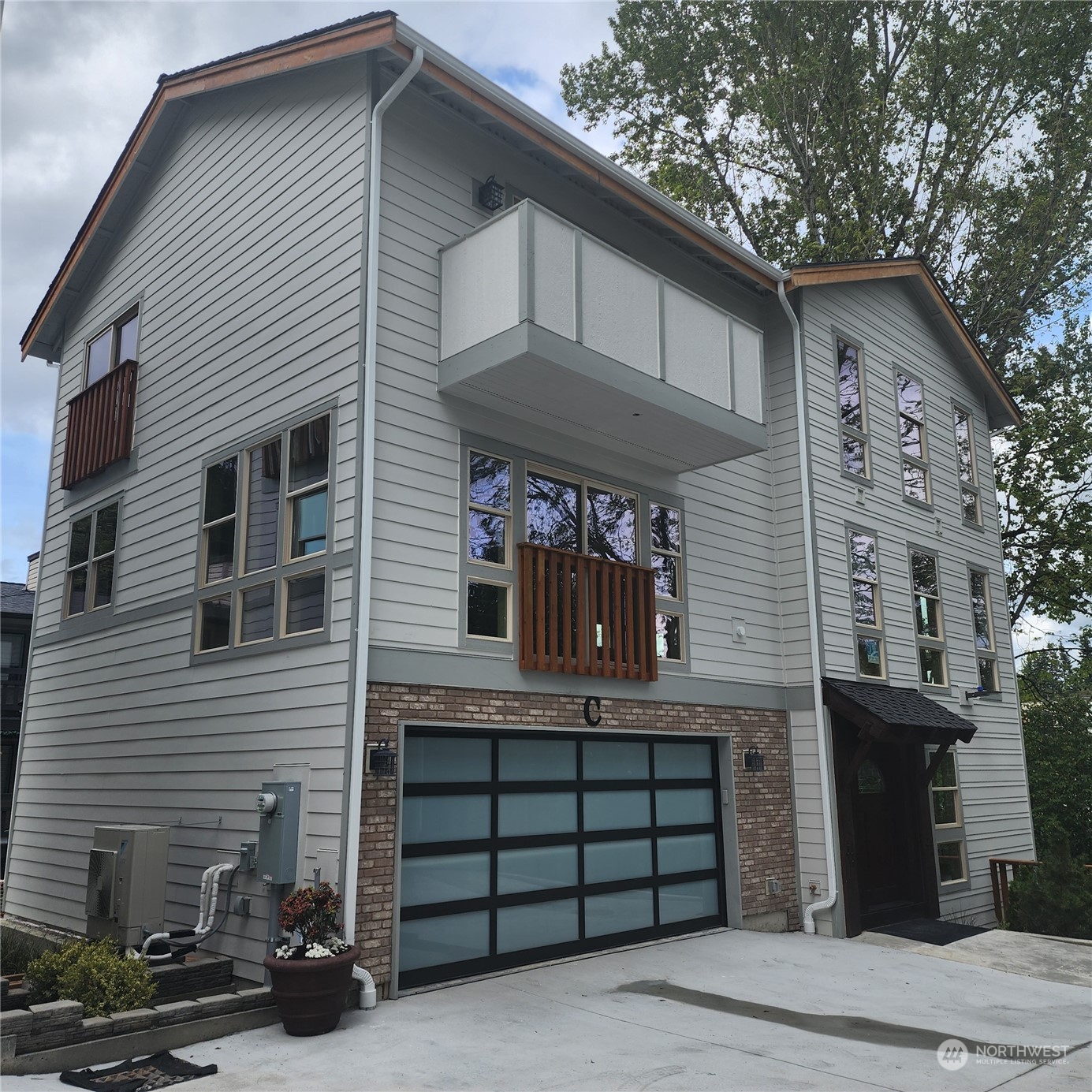 a front view of a house with a garage