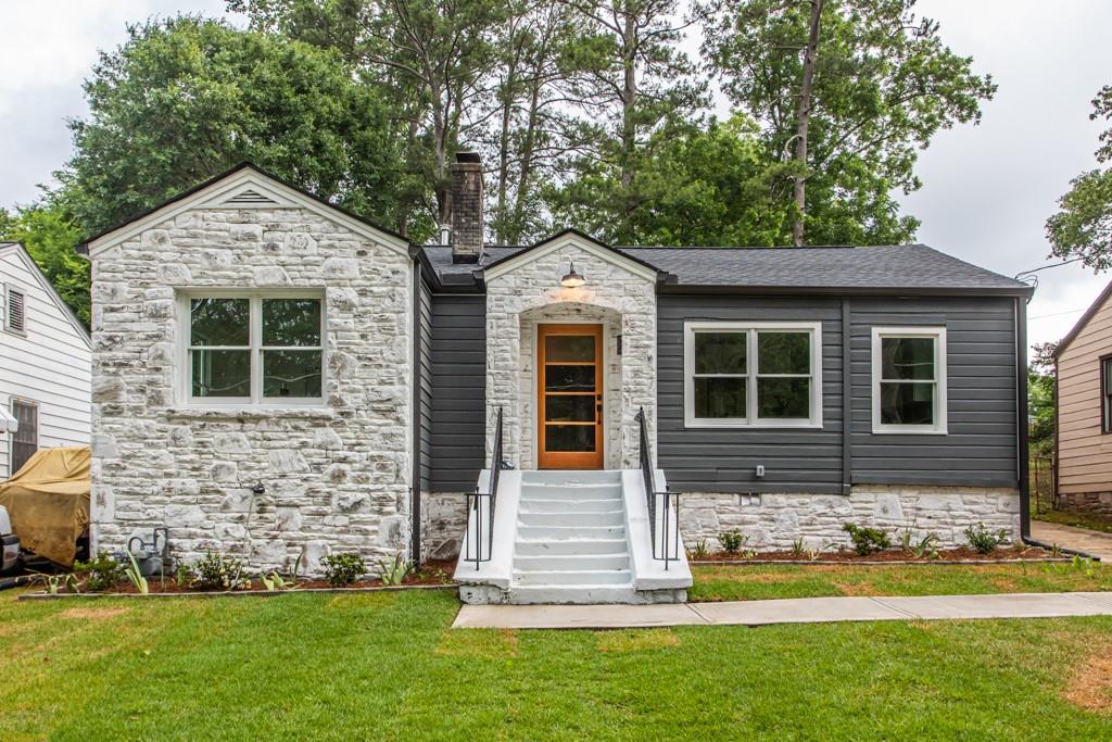 a front view of a house with a yard