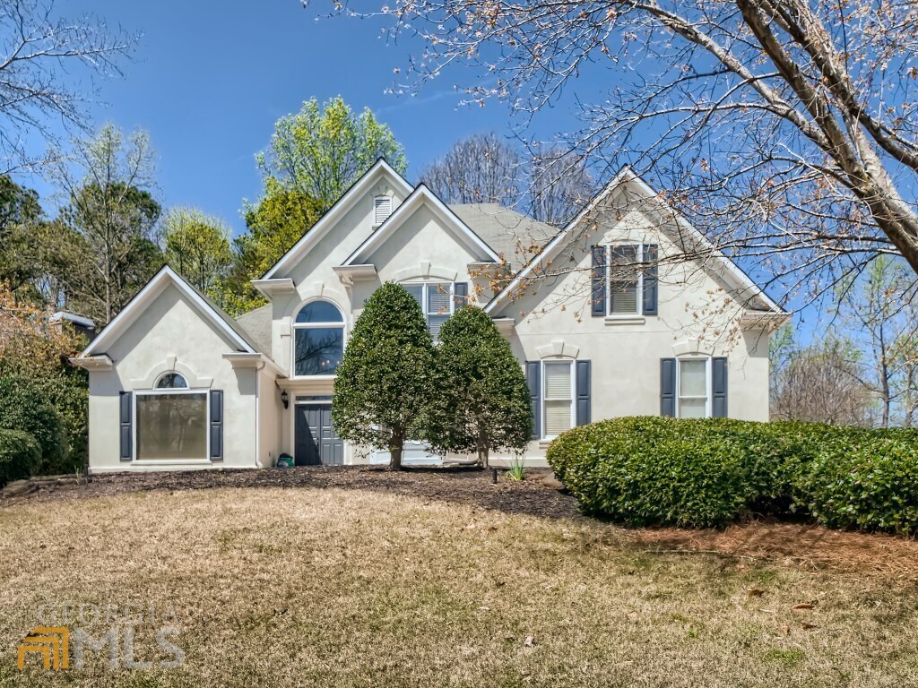 front view of a house with a yard