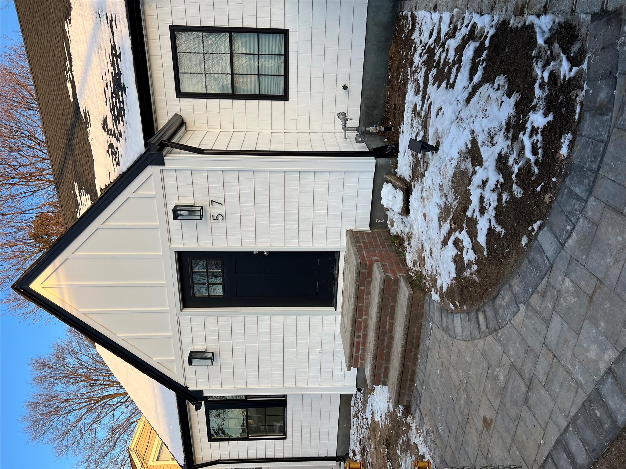 View of snow covered property entrance