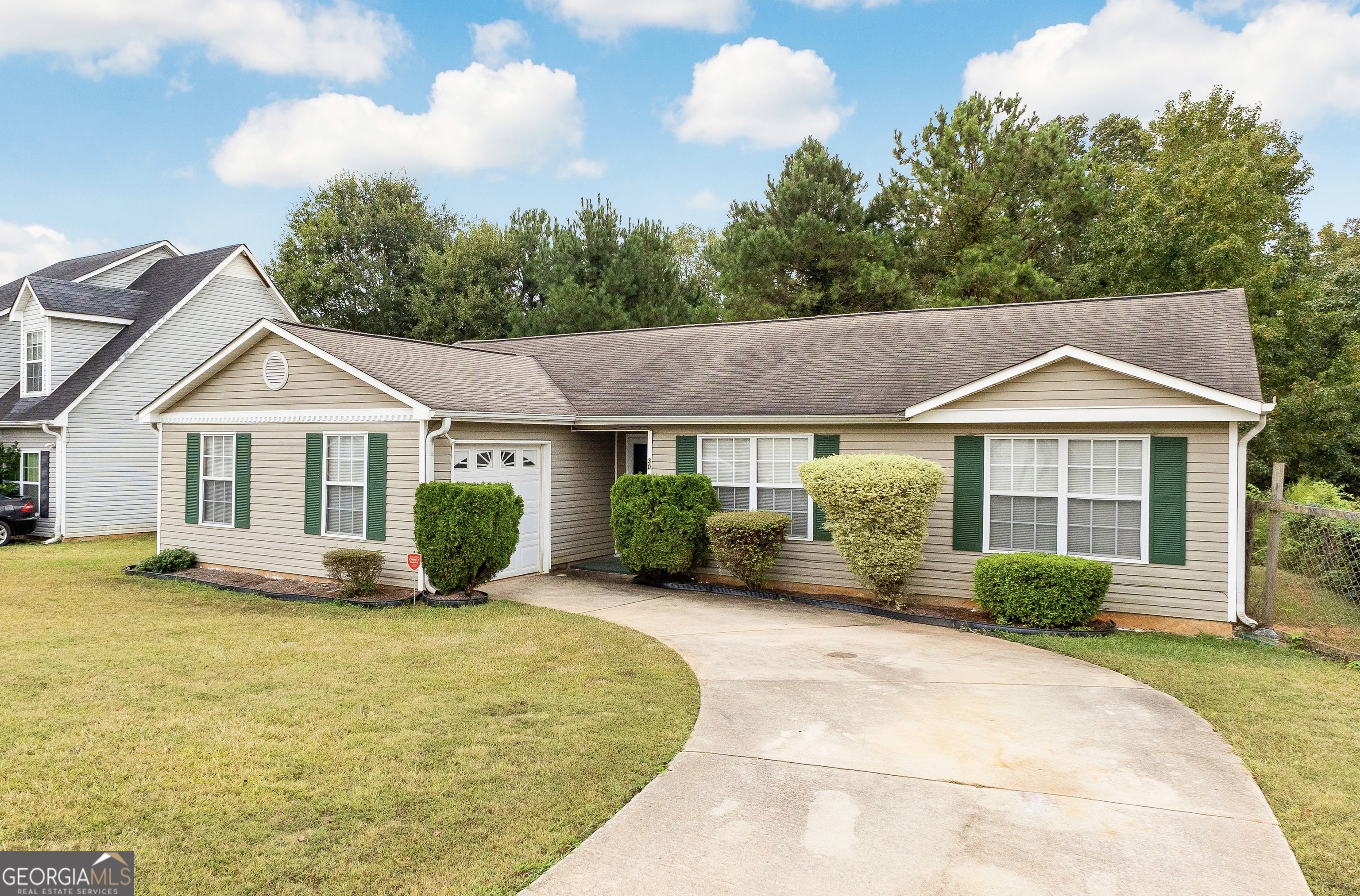 a front view of a house with a yard and porch