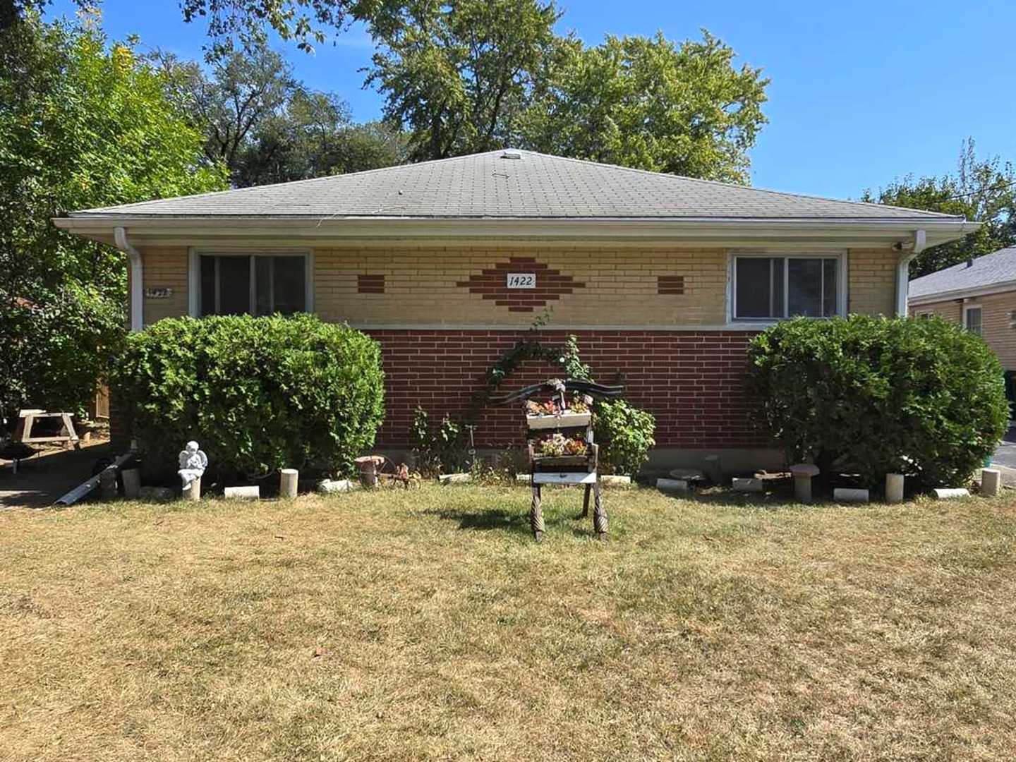 front view of a house with a yard