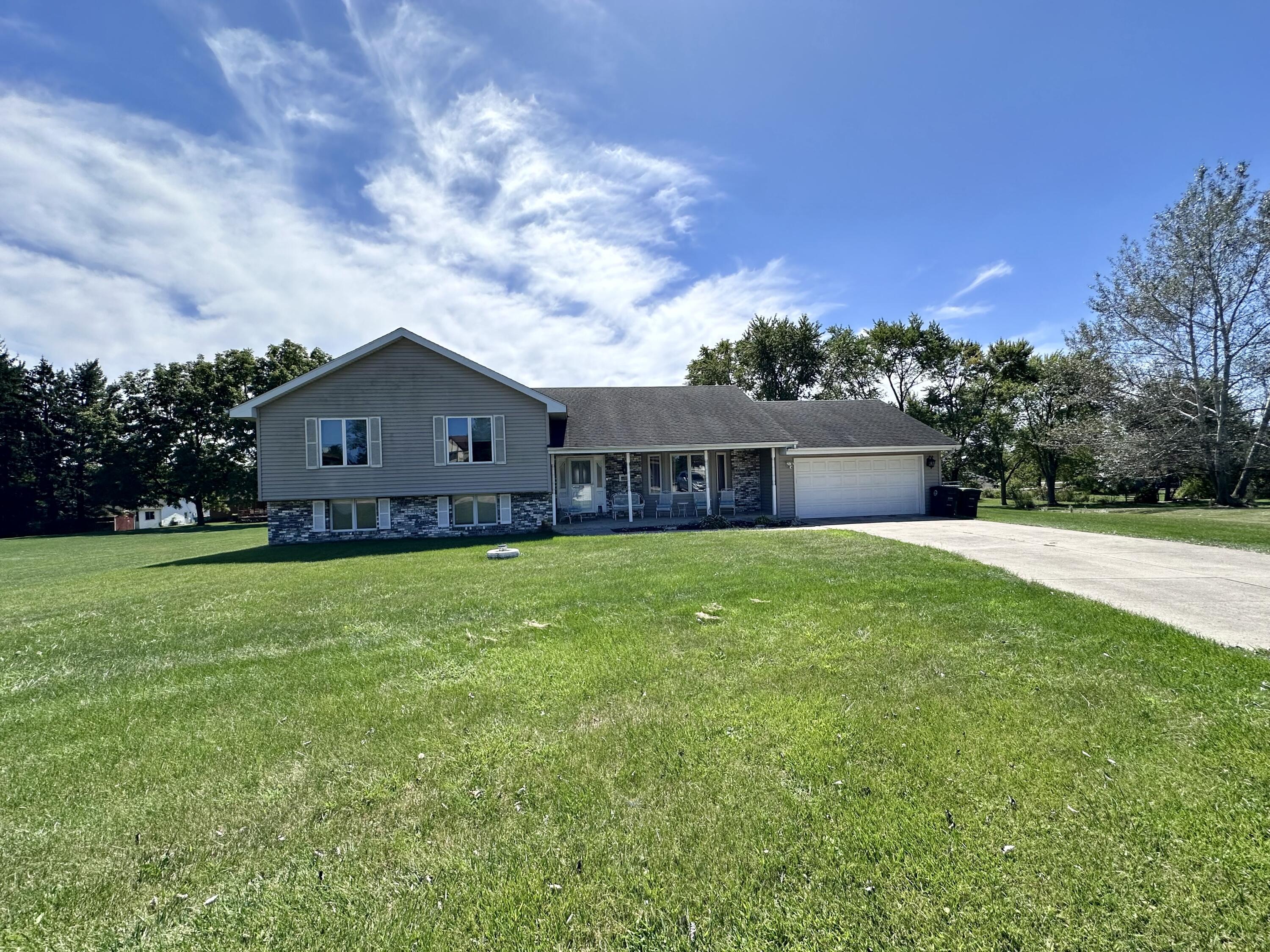 a view of house with a big yard