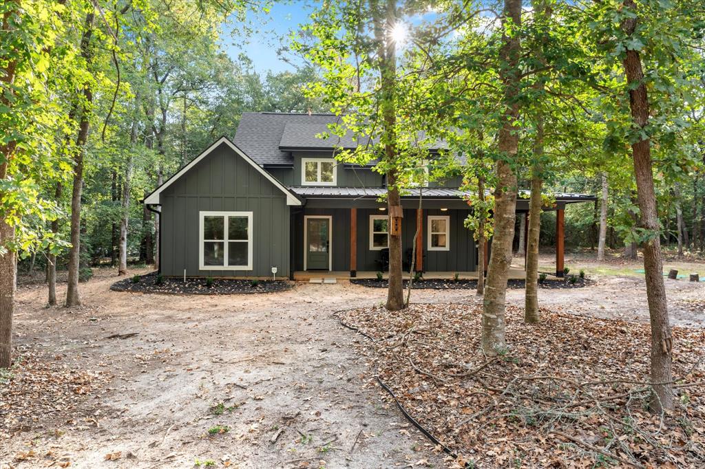 a house with trees in the background