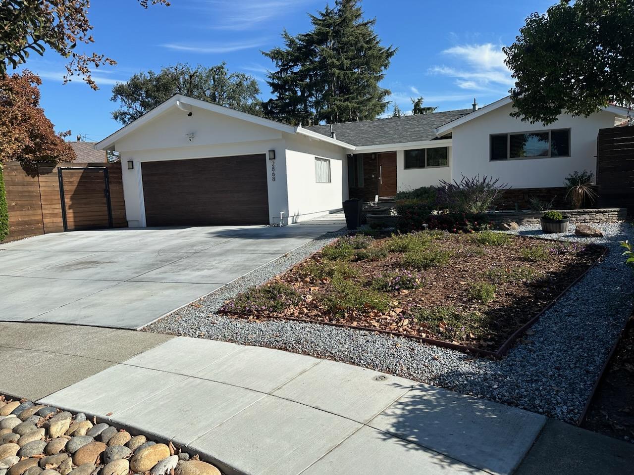 a front view of a house with garden