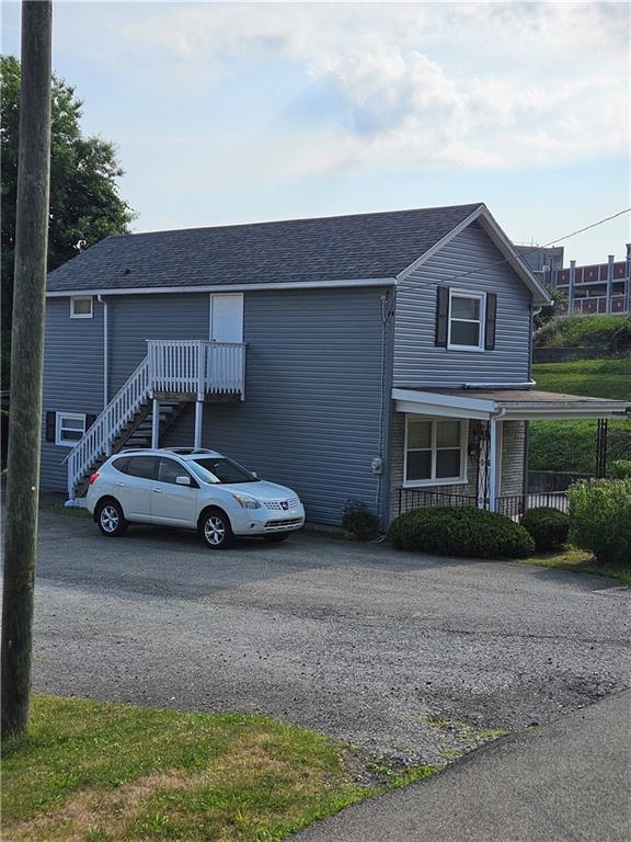 a car parked in front of a house