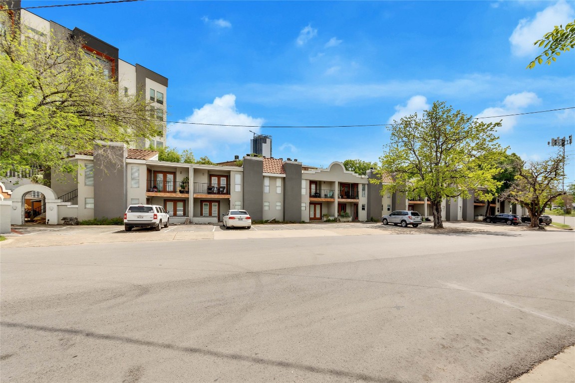 a couple of cars parked in front of a building