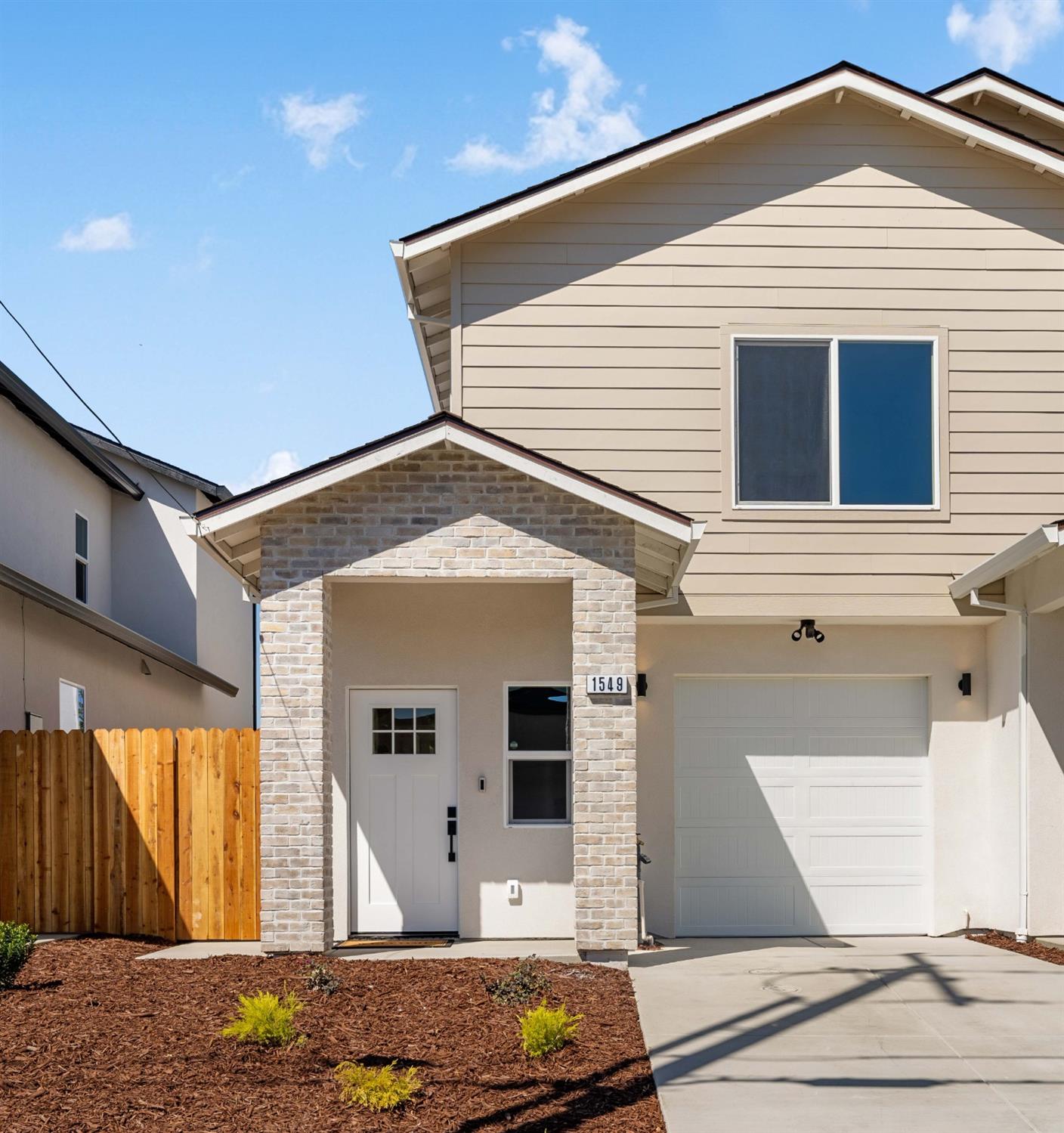 a front view of a house with a garage