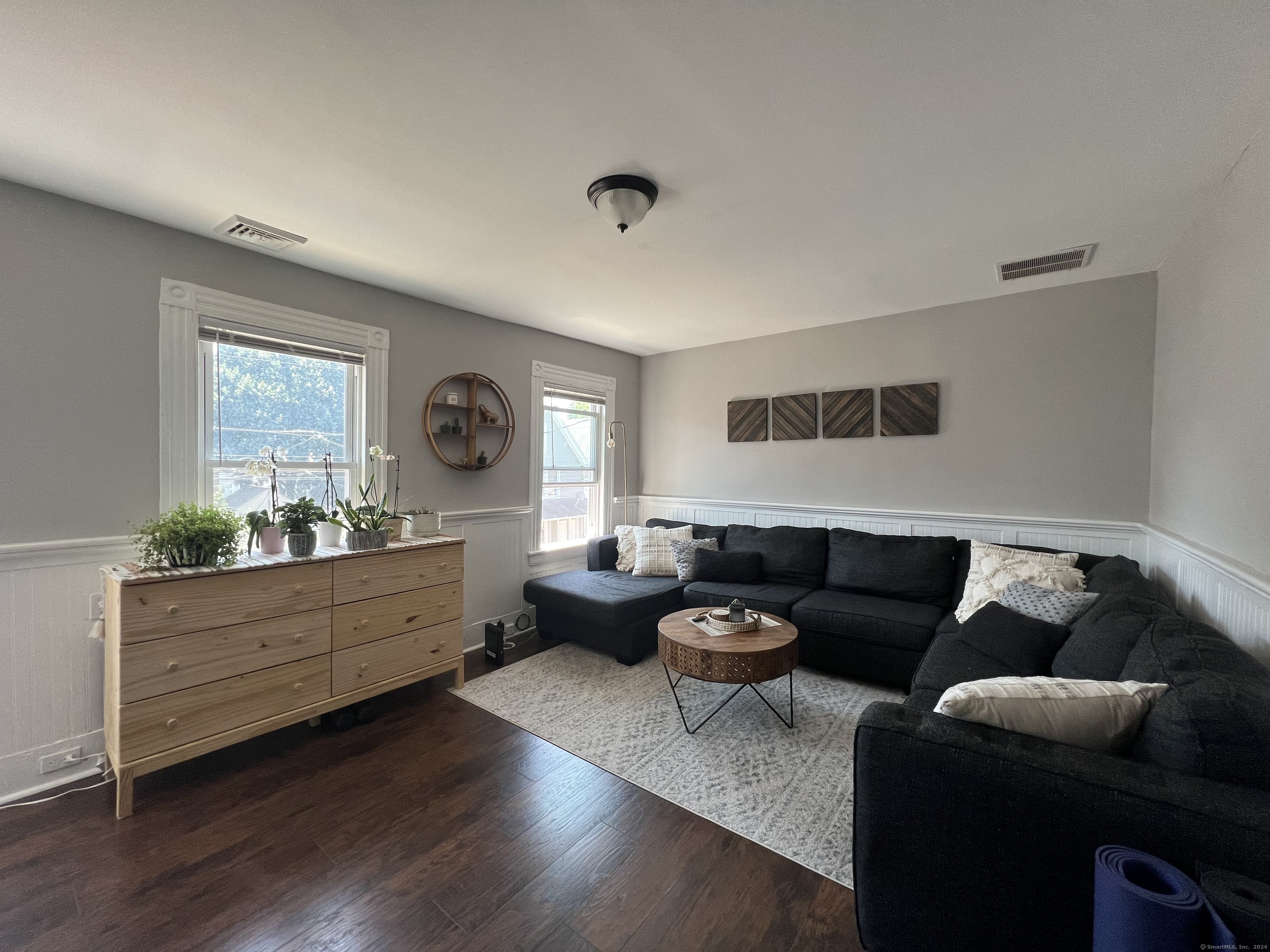 a living room with furniture and windows