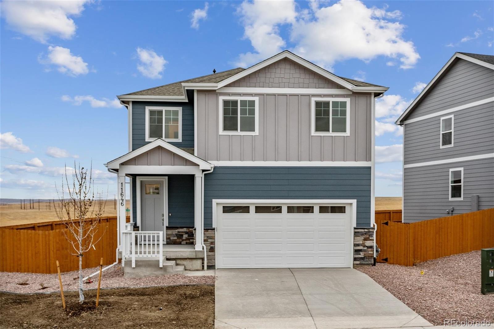 a front view of a house with yard