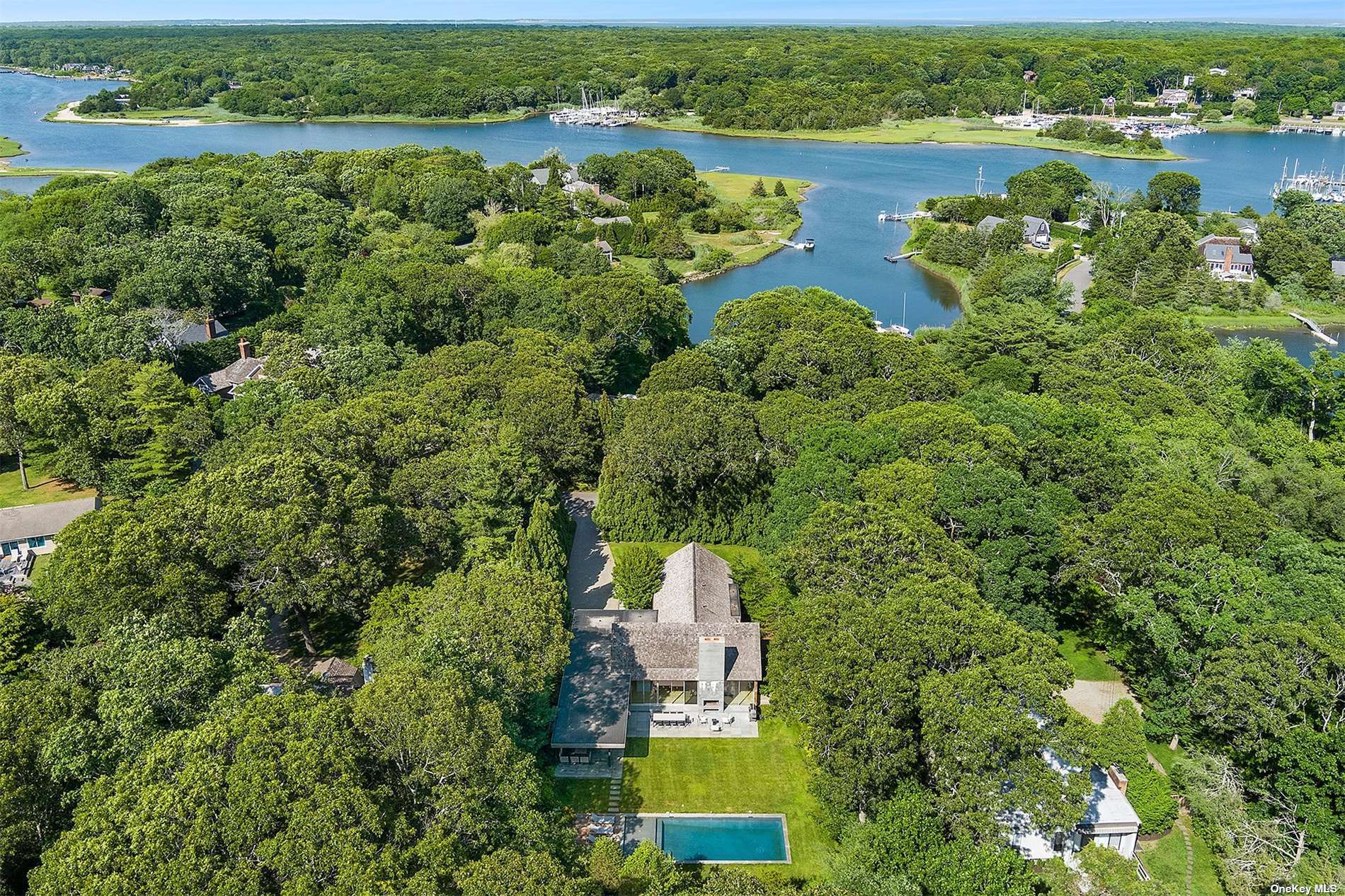 an aerial view of a house with a lake view