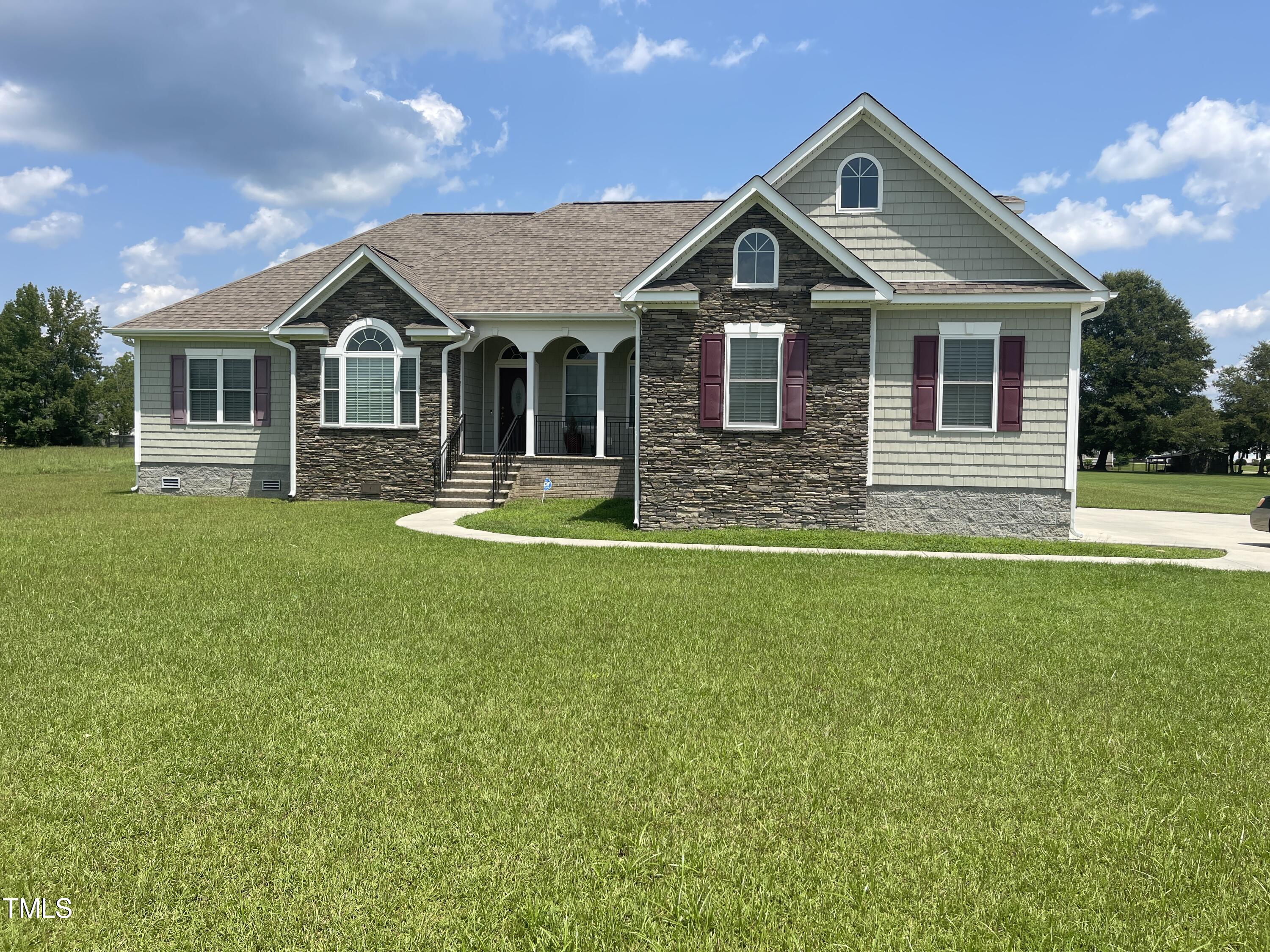 a front view of a house with a yard