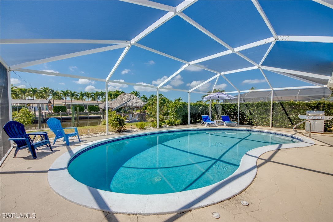 a view of a swimming pool with a patio