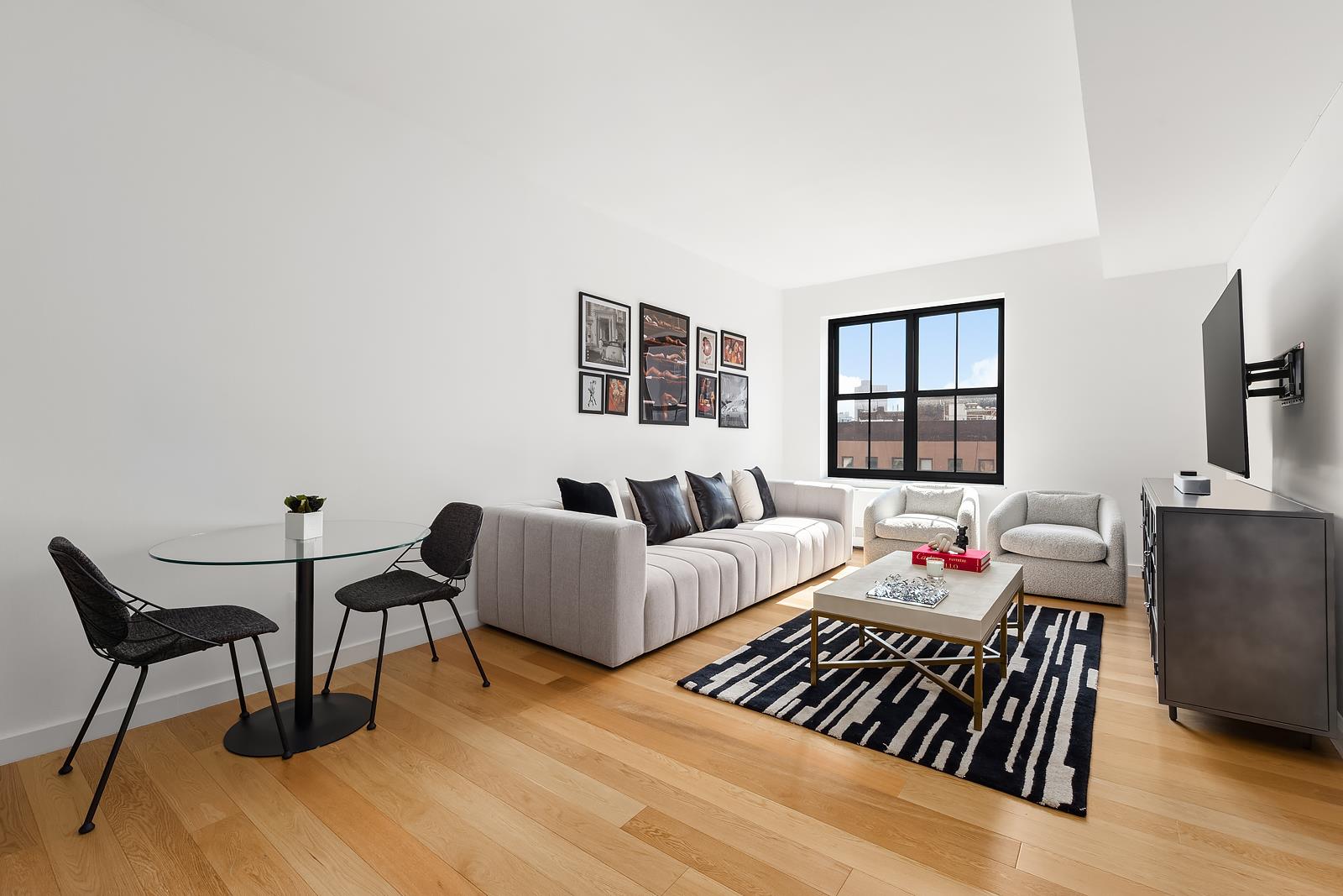 a bedroom with furniture and a wooden floor