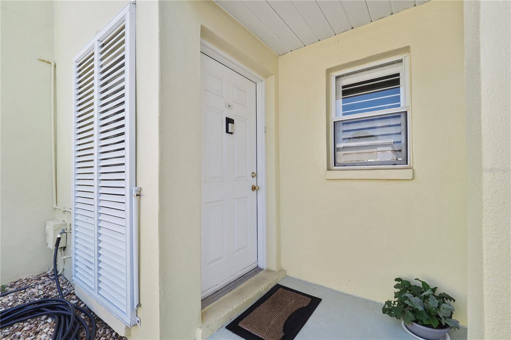 a view of an entryway with wooden floor