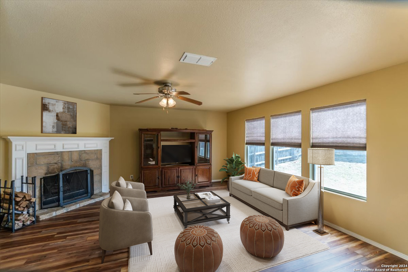 a living room with furniture and a fireplace