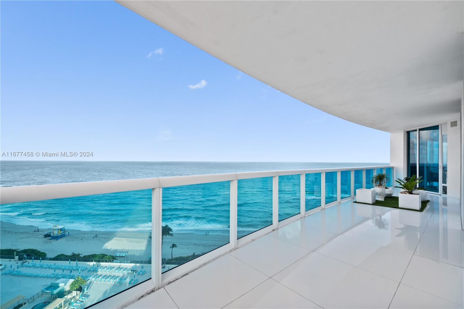 a view of a balcony with ocean view