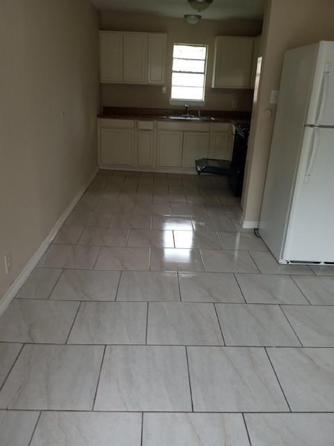 a kitchen with granite countertop a rug