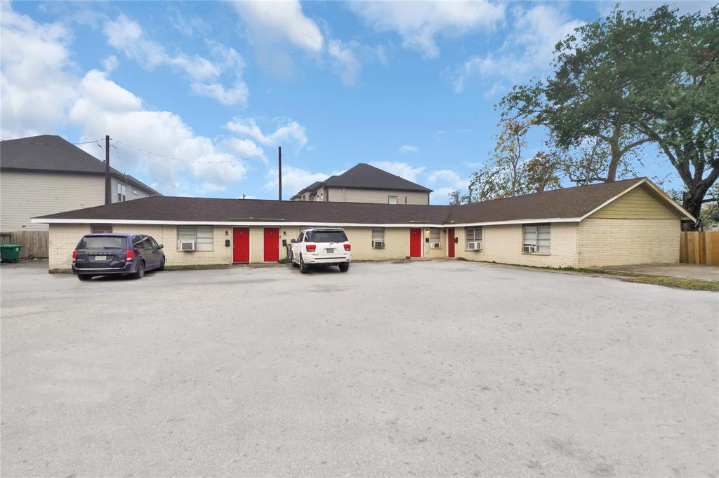 a view of house with outdoor space and car parked