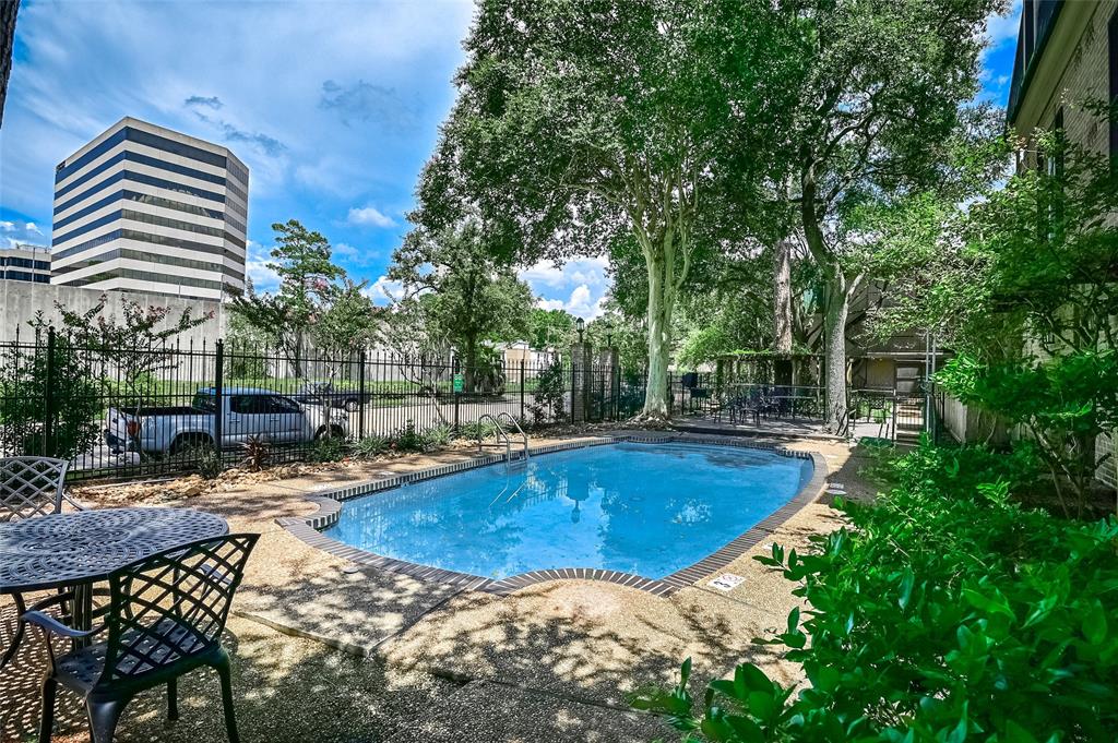 a view of a swimming pool with a lounge chairs